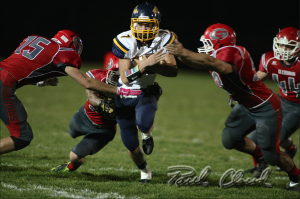 Leyton Stutsman runs for daylight through a group of Glenwood tacklers during Friday night's win.